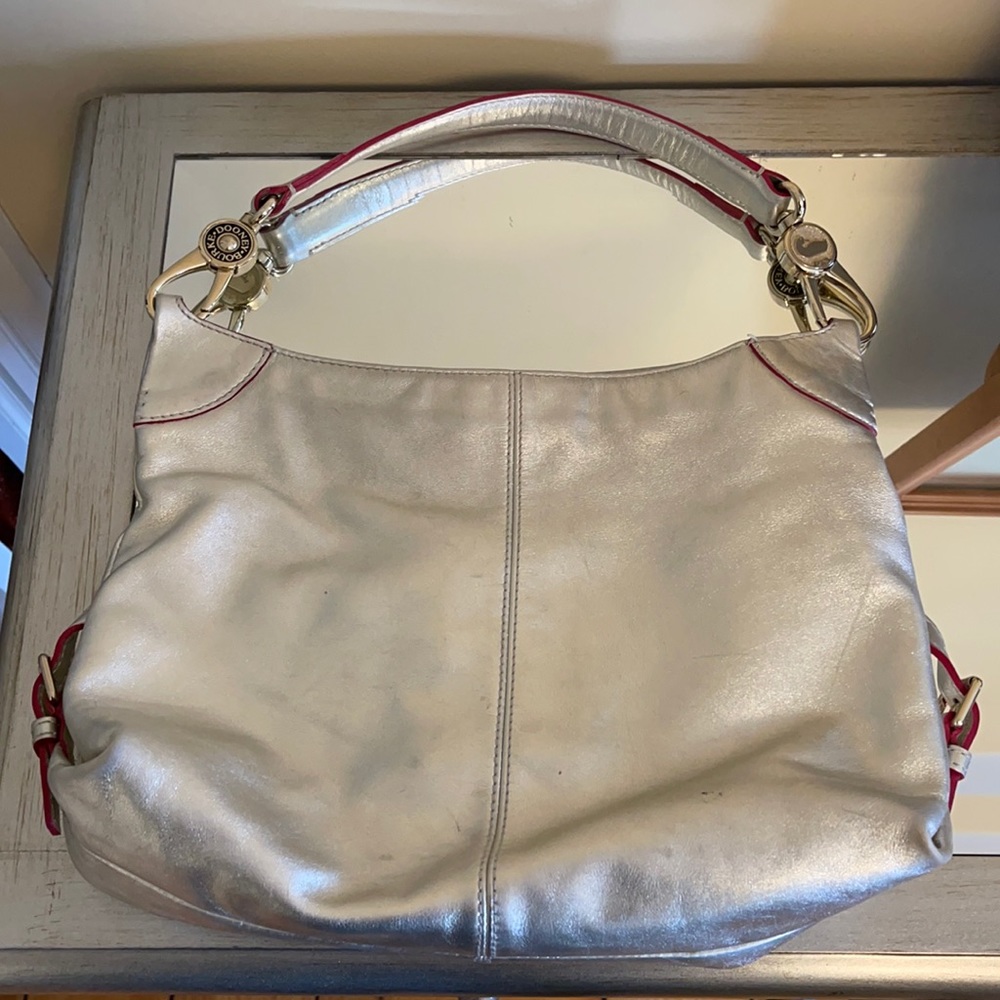 Metallic gray Dooney and Bourke leather shoulder hobo bag.